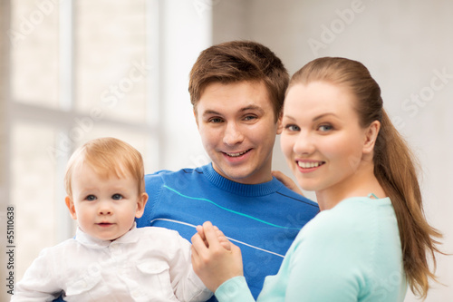 Photo: happy family with adorable baby happy family with adorable baby