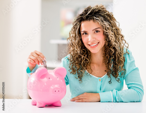 Photo: Woman saving money Woman saving money