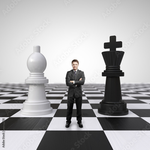 Photo: man on chessboard man on chessboard