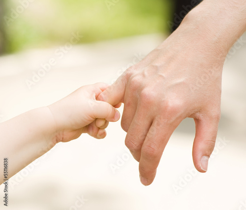 Photo: father's hand lead his child son father's hand lead his child son
