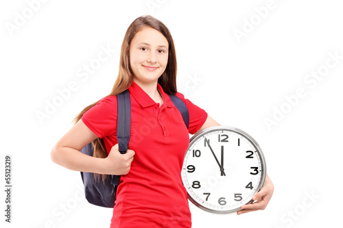 Photo: Female student holding a wall clock Female student holding a wall clock