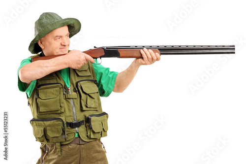 Photo: Male hunter shooting with a rifle Male hunter shooting with a rifle