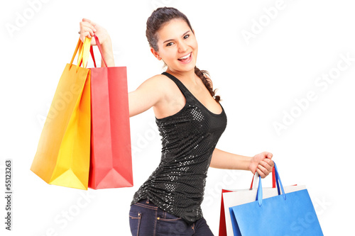 Photo: Young woman holding shopping bags Young woman holding shopping bags