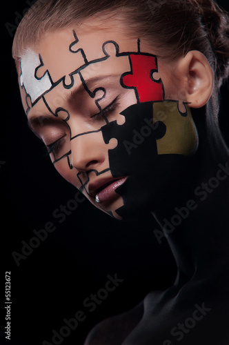 Photo: puzzles painted on face puzzles painted on face