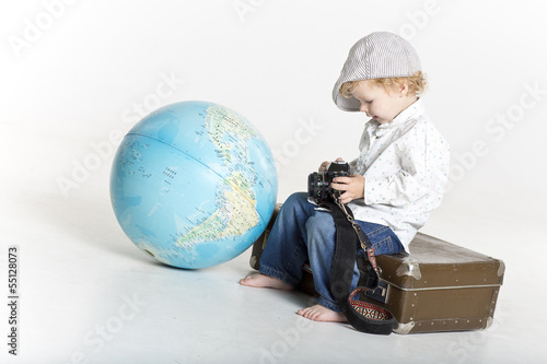 Photo: Toddler with old camera and suitcase Toddler with old camera and suitcase