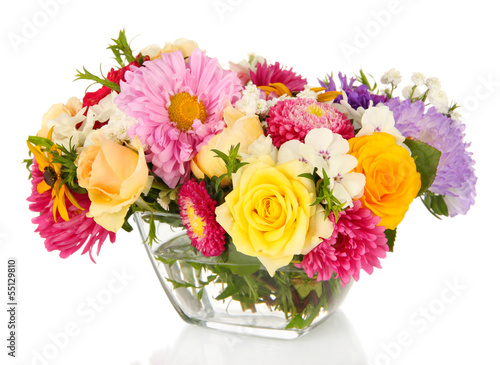 Photo: Beautiful bouquet of bright flowers in glass vase, isolated Beautiful bouquet of bright flowers in glass vase, isolated