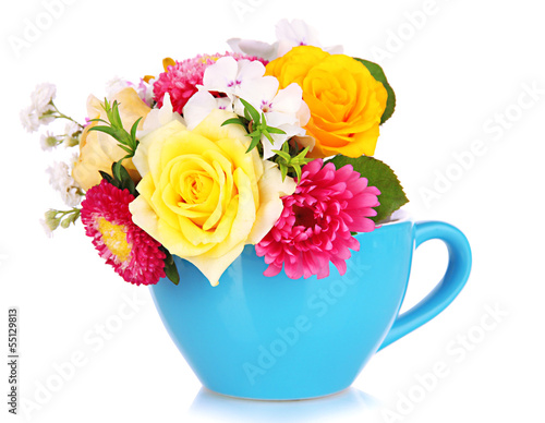 Photo: Beautiful bouquet of bright flowers in color mug, isolated Beautiful bouquet of bright flowers in color mug, isolated