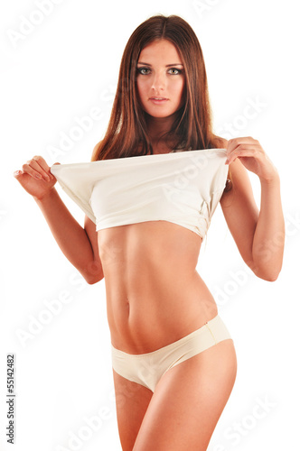 Photo: Young slim girl in her underwear isolated on white background Young slim girl in her underwear isolated on white background