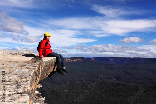 Photo: Sitting on Top of the World - hiker rests and admires views of B Sitting on Top of the World - hiker rests and admires views of B