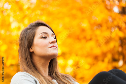 Photo: Woman relaxing in autumn Woman relaxing in autumn