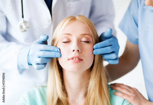 Photo: plastic surgeon and nurse with patient plastic surgeon and nurse with patient