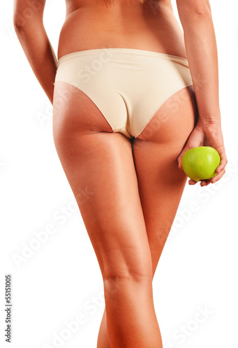 Photo: Slim woman's body isolated on white background Slim woman's body isolated on white background