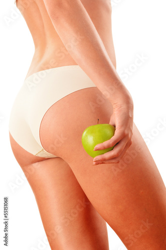 Photo: Slim woman's body isolated on white background Slim woman's body isolated on white background
