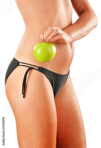 Photo: Slim woman's body isolated on white background Slim woman's body isolated on white background