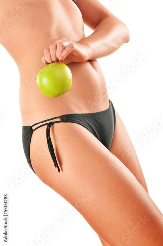 Photo: Slim woman's body isolated on white background Slim woman's body isolated on white background