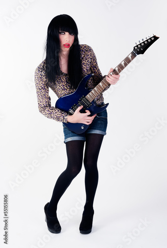 Photo: transvestite in heels with electric guitar transvestite in heels with electric guitar