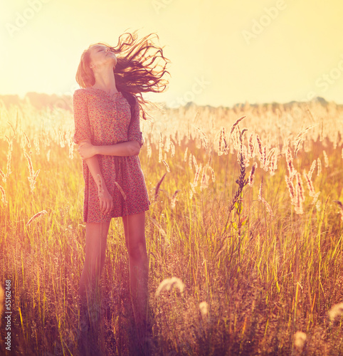 Photo: Beauty Girl Outdoor. Teenage Model Girl Posing in Sun Light Beauty Girl Outdoor. Teenage Model Girl Posing in Sun Light