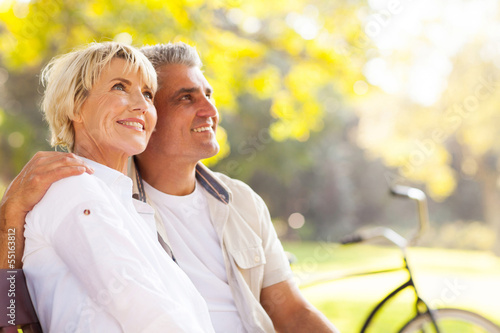 Photo: elegant mature couple sitting outdoors elegant mature couple sitting outdoors