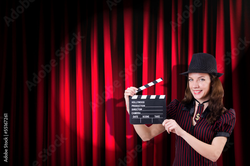 Photo: Woman gangster with movie clapper Woman gangster with movie clapper