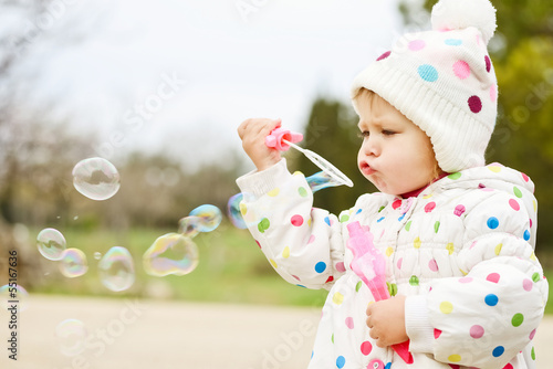Photo: cute toddler with soap bubbles cute toddler with soap bubbles