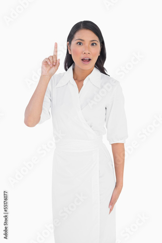 Photo: Smart dark haired model with classy dress posing Smart dark haired model with classy dress posing