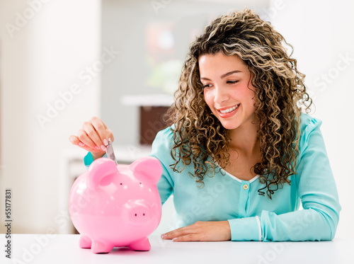 Photo: Happy woman saving money Happy woman saving money