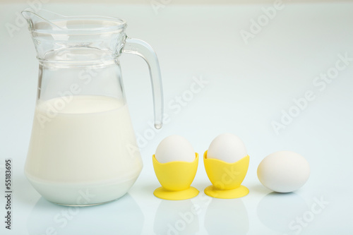 Photo: Milk in a glass jar and eggs Milk in a glass jar and eggs