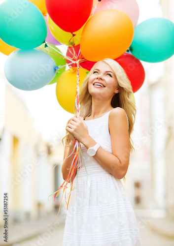 Photo: woman with colorful balloons woman with colorful balloons