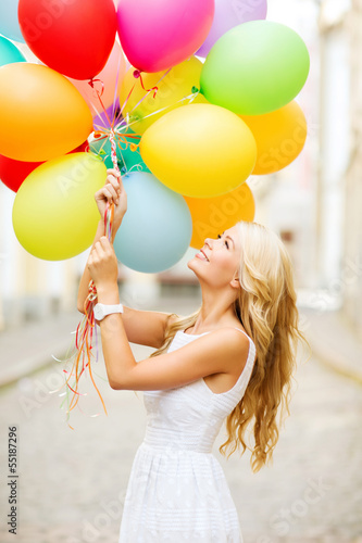 Photo: woman with colorful balloons woman with colorful balloons