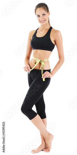 Photo: Young woman with measuring tape, isolated on white Young woman with measuring tape, isolated on white