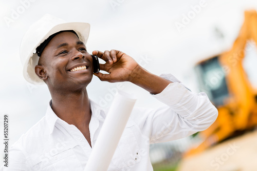 Photo: Architect making a business call Architect making a business call