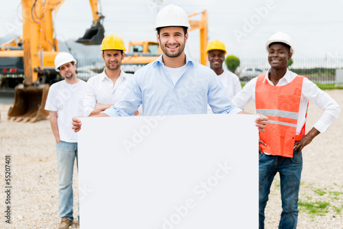 Photo: Architect holding a banner Architect holding a banner