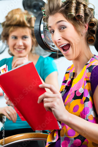 Photo: Women at the hairdresser with hair dryer Women at the hairdresser with hair dryer