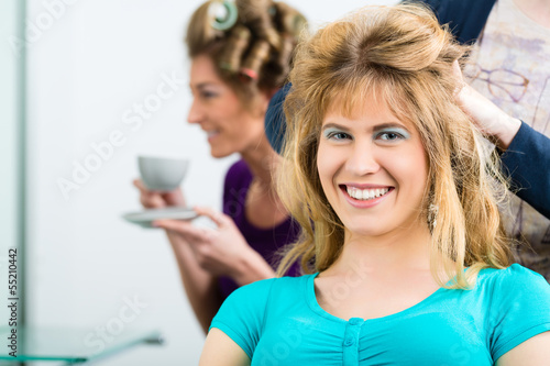 Photo: Hairdresser - hair stylist cutting hairs Hairdresser - hair stylist cutting hairs