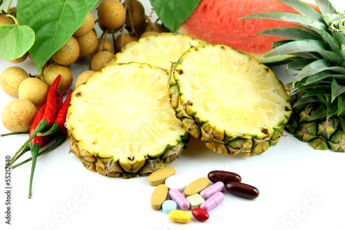 Photo: Fruits and medicines placed near the cosmetics. Fruits and medicines placed near the cosmetics.