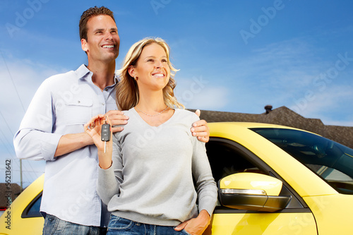 Photo: Couple with a new car key. Couple with a new car key.