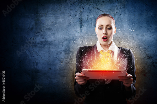 Photo: Young business woman with ipad Young business woman with ipad