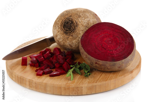 Photo: Sliced beetroot on board isolated on white Sliced beetroot on board isolated on white