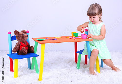 Photo: Little cute girl sitting Little cute girl sitting