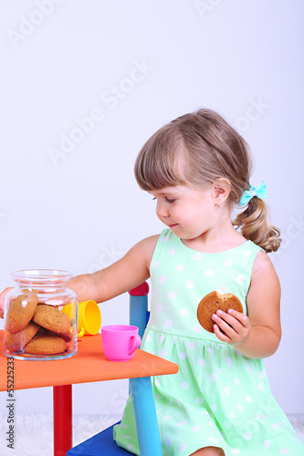 Photo: Little cute girl sitting Little cute girl sitting