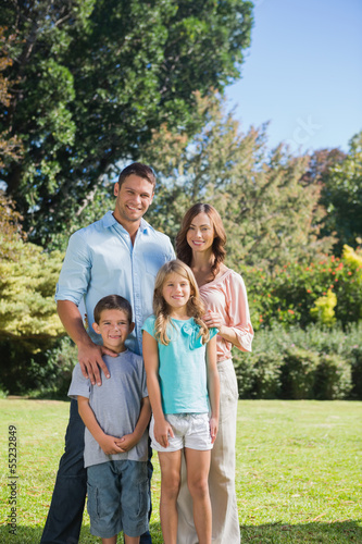 Photo: Family standing in the countryside Family standing in the countryside