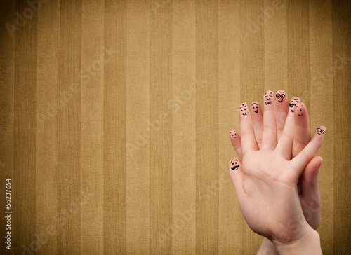 Photo: Happy finger smileys with vintage stripe wallpaper background Happy finger smileys with vintage stripe wallpaper background