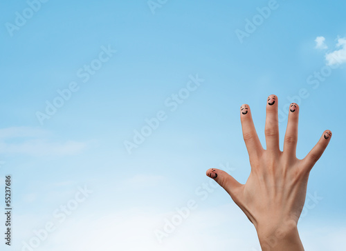 Photo: Happy smiley fingers looking at clear blue sky copyspace Happy smiley fingers looking at clear blue sky copyspace