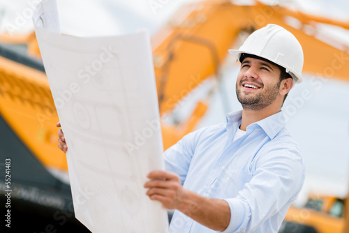 Photo: Architect looking at blueprints Architect looking at blueprints