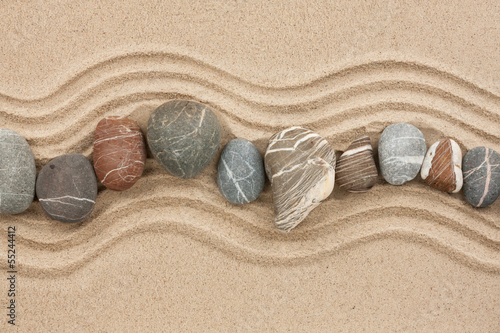 Photo: Striped stones on the sand Striped stones on the sand