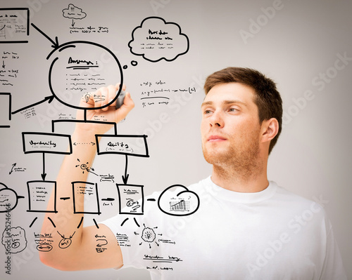 Photo: man drawing plan on the virtual screen man drawing plan on the virtual screen