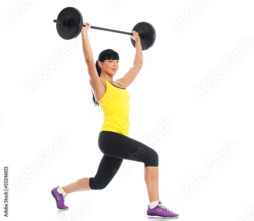 Photo: Beautiful fitness girl liftings weights Beautiful fitness girl liftings weights
