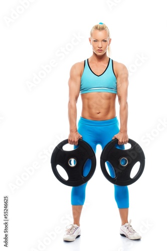 Photo: Beautiful bodybuilder girl holding weights Beautiful bodybuilder girl holding weights