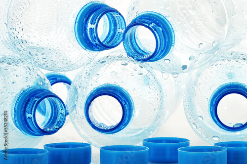 Photo: Composition with empty polycarbonate plastic bottles of mineral Composition with empty polycarbonate plastic bottles of mineral