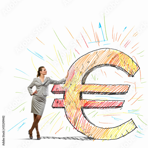 Photo: Businesswoman leaning on euro sign Businesswoman leaning on euro sign